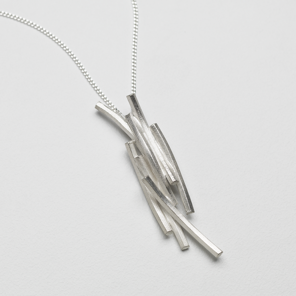 Pendant featuring hexagonal silver extrusions similar to rock formations on Staffa.