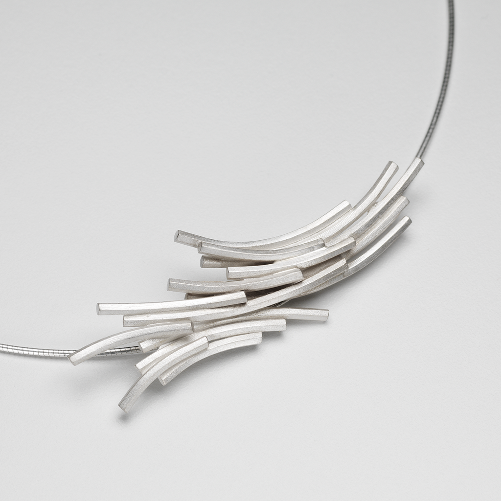Necklace featuring hexagonal silver extrusions similar to rock formations on Staffa.