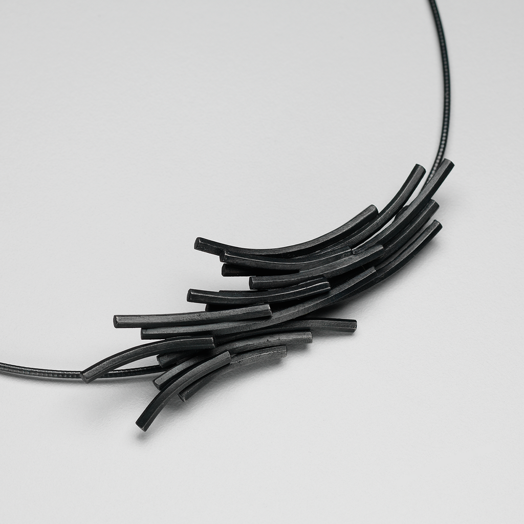 Necklace featuring hexagonal oxidised silver extrusions similar to rock formations on Staffa.
