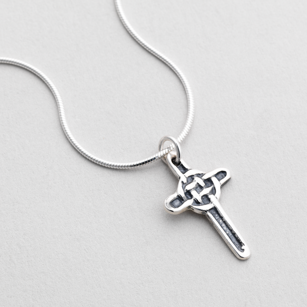 Silver necklace featuring simple celtic interlaced cross design
