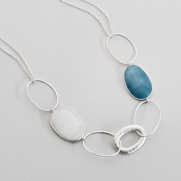 Silver necklace featuring loops, Iona marble and enammeled components.
